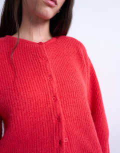Model wearing Knitted easy ribbed relaxed cardigan in red