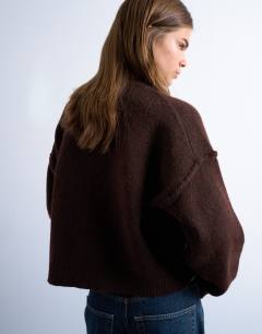 Model wearing Knitted exposed seam relaxed cardigan in brown