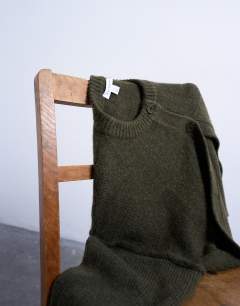 Model wearing Knitted exposed seam relaxed cardigan in khaki