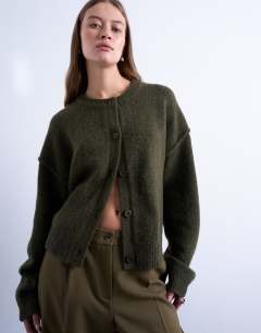 Model wearing Knitted exposed seam relaxed cardigan in khaki