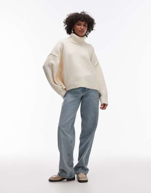 Topshop knitted exposed seam roll neck relaxed jumper in ivory ASOS