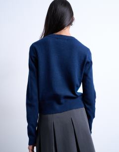 Model wearing Knitted fine argyle cardigan in navy