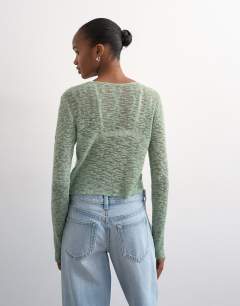 Model wearing Knitted fine long sleeve ruched top in sage