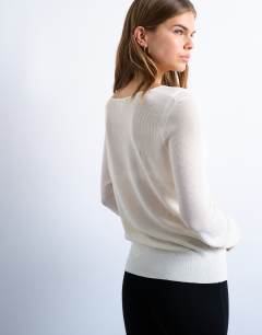 Model wearing Knitted fine rib cardigan in ivory