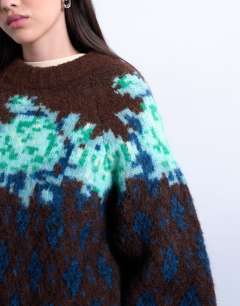 Model wearing Knitted flower and argyle jumper in multi
