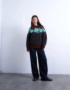 Model wearing Knitted flower and argyle jumper in multi