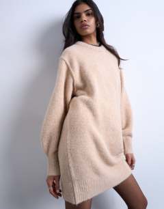 Model wearing Knitted fluffy crew mini dress in oat