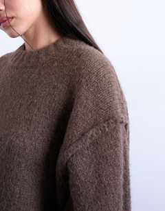 Model wearing Knitted fluffy exposed seam easy jumper in brown