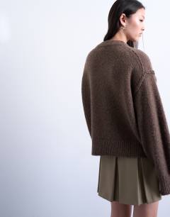 Model wearing Knitted fluffy exposed seam easy jumper in brown