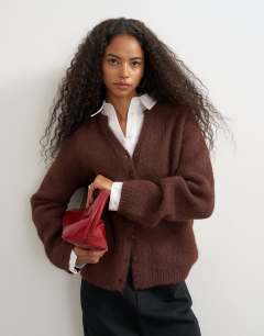 Model wearing Knitted fluffy eyelash cardigan in chocolate