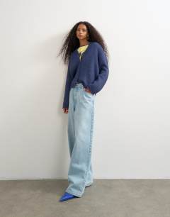 Model wearing Knitted fluffy eyelash cardigan in navy