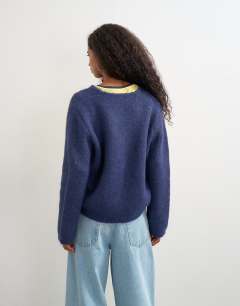 Model wearing Knitted fluffy eyelash cardigan in navy