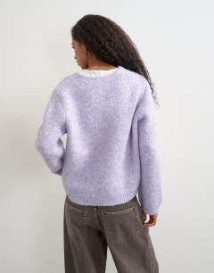 Model wearing Knitted fluffy eyelash cardigan in periwinkle