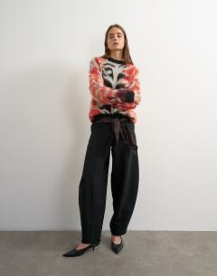 Model wearing Knitted fluffy relaxed fit brushed abstract crew neck jumper in red