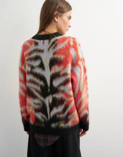 Model wearing Knitted fluffy relaxed fit brushed abstract crew neck jumper in red