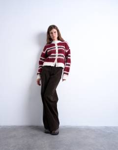 Model wearing Knitted fluffy stripe cardigan in pink