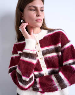 Model wearing Knitted fluffy stripe cardigan in pink