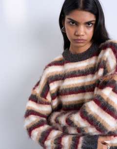 Model wearing Knitted fluffy stripe jumper in neutral and burgundy