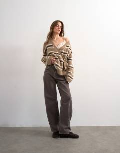 Model wearing Knitted fluffy stripe wrap tie cardigan in neutral