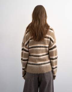 Model wearing Knitted fluffy stripe wrap tie cardigan in neutral