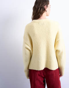 Model wearing Knitted fluffy ultimate jumper in yellow 