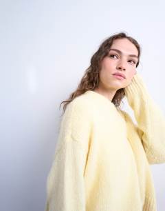 Model wearing Knitted fluffy ultimate jumper in yellow 