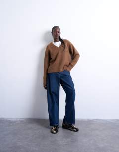 Model wearing Knitted fluffy v neck jumper in brown