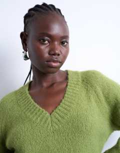 Model wearing Knitted fluffy v neck jumper in green