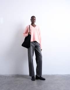 Model wearing Knitted fluffy v neck jumper in pink