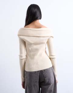 Model wearing Knitted foldover long sleeve top in ivory