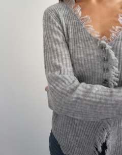 Model wearing Knitted frayed neckline cardigan in grey