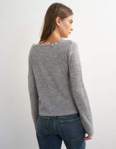 Model wearing Knitted frayed neckline cardigan in grey