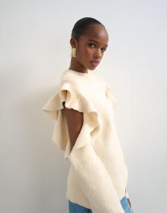 Model wearing Knitted frill sleeve jumper in ivory