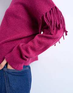 Model wearing Knitted fringe detail jumper in plum