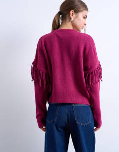 Model wearing Knitted fringe detail jumper in plum