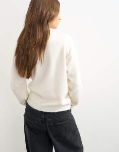 Model wearing Knitted front tie jumper with wool and alpaca in ivory