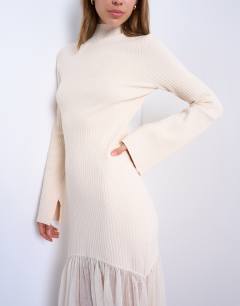 Model wearing Knitted full skirt dress in ivory