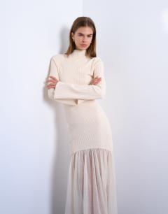 Model wearing Knitted full skirt dress in ivory