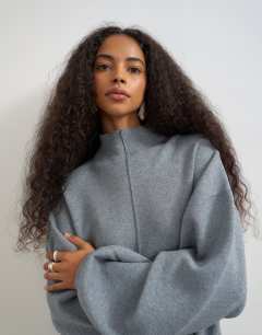 Model wearing Knitted funnel neck cinch hem co-ord jumper in grey
