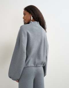 Model wearing Knitted funnel neck cinch hem co-ord jumper in grey