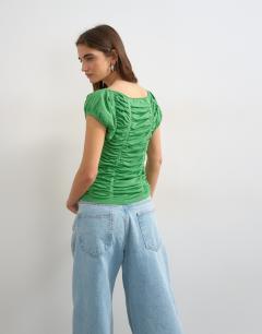 Model wearing Knitted gathered detail cap sleeve top in green