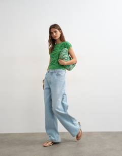 Model wearing Knitted gathered detail cap sleeve top in green
