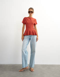 Model wearing Knitted grown on short sleeve peplum top in deep red