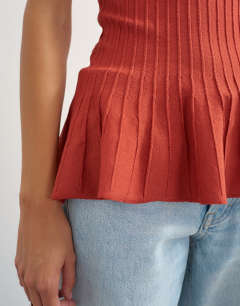 Model wearing Knitted grown on short sleeve peplum top in deep red