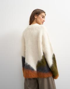 Model wearing Knitted hairy abstract colour block stripe wool crew neck jumper in ivory multi