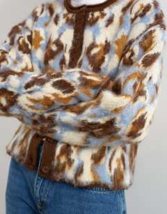 Model wearing Knitted hairy crew neck cardigan in blue floral