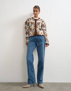 Model wearing Knitted hairy crew neck cardigan in blue floral
