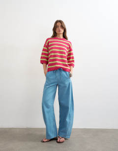 Model wearing Knitted half sleeve relaxed fit t-shirt in pink multi