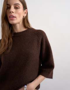 Model wearing Knitted half sleeve t-shirt in chocolate 