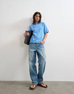 Model wearing Knitted half sleeve t-shirt in cornflower blue